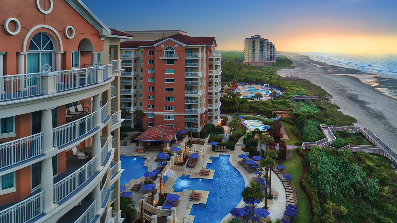 Aerial view of exterior, pool area and beach at Marriott's OceanWatch timeshare resort